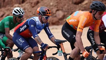 The Netherlands' Dylan Groenewegen (L) (Team Jayco Alula) and Spain's Xabier Azparren Irurzun (Euskaltel-Euskadi) ride during the third stage of Al-Ula Tour cycling race at near Al-Ula on February 1, 2024. 
Anne-Christine POUJOULAT / AFP