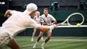 Britain's Joe Salisbury (R) returns the ball to Netherlands' Sem Verbeek and Czech Republic's Katerina Siniakova during their mixed's doubles final tennis match on the eleventh day of the 2025 Wimbledon Championships at The All England Lawn Tennis and Croquet Club in Wimbledon, southwest London, on July 10, 2025. 
Kirill KUDRYAVTSEV / AFP