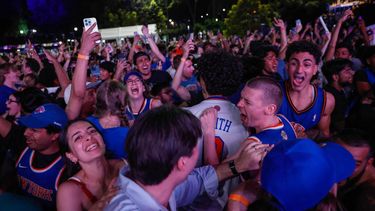 Knicks fans celebrate in Central Park after the New York Knicks defeated the San Antonio Spurs in Game 5 of the NBA Finals to win the series, in New York, on June 13, 2026. The Knicks won the NBA Championship for the first time since 1973, for the third time in franchise history.
kena betancur / AFP