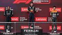 2023-10-22 23:11:33 (L-R) Mercedes' British driver Lewis Hamilton, Red Bull Racing's Dutch driver Max Verstappen and McLaren's British driver Lando Norris listen to the national anthems on the podium after the 2023 United States Formula One Grand Prix at the Circuit of the Americas in Austin, Texas, on October 22, 2023.  
Jim WATSON / AFP