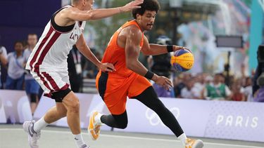 Latvia's #01 Nauris Miezis tries to block Netherlands' #13 Dimeo van der Horst (R) in the men's pool round 3x3 basketball game between Latvia and the Netherlands during the Paris 2024 Olympic Games at La Concorde in Paris on July 31, 2024. 
David GRAY / AFP