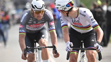 epa12029609 Slovenian rider Tadej Pogacar of UAE Team Emirates (R) competes in the Paris-Roubaix one-day cycling classic over 259.2km from Compiegne to Roubaix, France, 13 April 2025.  EPA/PAPON BERNARD / POOL