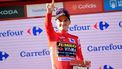 2023-09-09 17:56:43 Team Jumbo-Visma's US rider Sepp Kuss wearing the overall leader's red jersey celebrates on the podium after the stage 14 of the 2023 La Vuelta cycling tour of Spain, a 156,2 km race between Sauveterre-de-Bearn and Larra Belagua, on September 9, 2023. 
Ander GILLENEA / AFP
