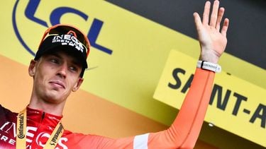 INEOS Grenadiers team's Dutch rider Thymen Arensman celebrates on the podium after winning the 14th stage of the 112th edition of the Tour de France cycling race, 182.6 km between Pau and Luchon-Superbagneres, in the Pyrenees mountains of southwestern France, on July 19, 2025. 
Marco BERTORELLO / AFP