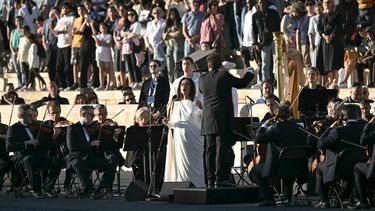 Greek singer Nana Mouskouri (C) performs the French national anthem during the handover ceremony of the Olympic Flame for the Paris 2024 Summer Olympic and Paralympic Games at Panathinean stadium in Athens, on April 26, 2024. The ceremony marks the culmination of an 11-day Olympic Torch Relay across Greece and begins an epic three-month torch relay and countdown to the Opening Ceremony of the Paris 2024 Olympic Games, on 26 July, 2024.

Aris MESSINIS / AFP