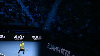 Spain's Carlos Alcaraz hits a return during his match against Australia's Alex De Minaur at the ATP Finals tennis tournament in Turin on November 9, 2025. 
Marco BERTORELLO / AFP