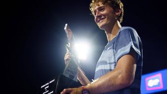 epa11526535 Sebastian Korda of the USA holds the championship trophy after winning the Mens Final match against Flavio Cobolli of Italy during the Mubadala Citi DC Open, in Washington, DC, USA, 04 August 2024.  EPA/WILL OLIVER