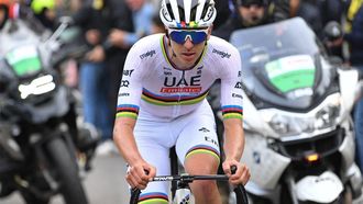 UAE Team Emirates team's Slovenian rider Tadej Pogacar cycles in a lone breakaway in the final ascent of San Fermo Della Battaglia during the 118th edition of the Giro di Lombardia (Tour of Lombardy), a 252km cycling race from Bergamo to Como on October 12, 2024. 
Tim De Waele / POOL / AFP