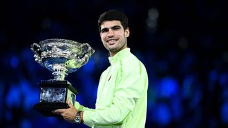 epa12697298 Carlos Alcaraz of Spain poses with the trophy after winning the Men’s Singles final match against Novak Djokovic of Serbia at the Australian Open tennis tournament in Melbourne, Australia, 01 February 2026.  EPA/JOEL CARRETT AUSTRALIA AND NEW ZEALAND OUT