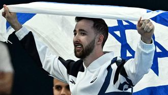 Israel's Artem Dolgopyat celebrates his silver medal at the end of the artistic gymnastics men's floor exercise final during the Paris 2024 Olympic Games at the Bercy Arena in Paris, on August 3, 2024. 
Lionel BONAVENTURE / AFP