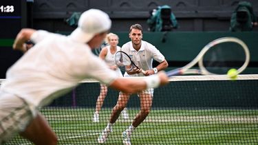 Britain's Joe Salisbury (R) returns the ball to Netherlands' Sem Verbeek and Czech Republic's Katerina Siniakova during their mixed's doubles final tennis match on the eleventh day of the 2025 Wimbledon Championships at The All England Lawn Tennis and Croquet Club in Wimbledon, southwest London, on July 10, 2025. 
Kirill KUDRYAVTSEV / AFP