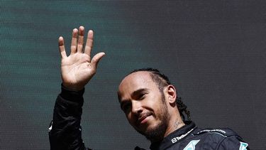 Mercedes' British driver Lewis Hamilton waves as he arrives for the podium ceremony after the Formula One Belgian Grand Prix at the Spa-Francorchamps Circuit in Spa on July 28, 2024. 
SIMON WOHLFAHRT / AFP