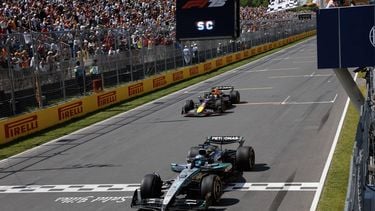 Mercedes' British driver George Russell crosses the finish line as he wins the race, followed by Red Bull Racing's Dutch driver Max Verstappen in second place, during the 2025 Formula 1 Grand Prix du Canada at Circuit Gilles-Villeneuve in Montreal, Canada, on June 15, 2025.  
SHAWN THEW / POOL / AFP