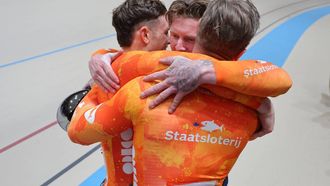 Netherlands'#168 Harrie Lavreysen,  #169 Roy Van der Berg, and #166 Jeffrey Hoogland celebrate after winning the men's team sprint final during the 2025 UCI Track World Championships at the Peñalolen Velodrome, in Santiago, on October 22, 2025. 
Javier TORRES / AFP