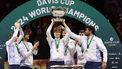 Italy's Jannik Sinner raises the trophy with teammates after winning the Davis Cup Finals at the Palacio de Deportes Jose Maria Martin Carpena arena in Malaga, southern Spain, on November 24, 2024. 
Thomas COEX / AFP