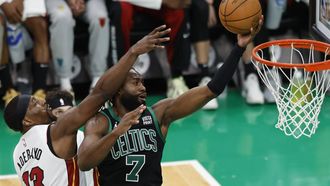 epa11313608 Boston Celtics guard Jaylen Brown (R) shoots as Miami Heat center Bam Adebayo (L) defends during the second half of the Eastern Conference first round game five between the Boston Celtics and the Miami Heat in Boston, Massachusetts, USA, 01 May 2024. The Boston Celtics defeated the Miami Heat and advance to the Eastern Conference Semi-finals.  EPA/CJ GUNTHER SHUTTERSTOCK OUT