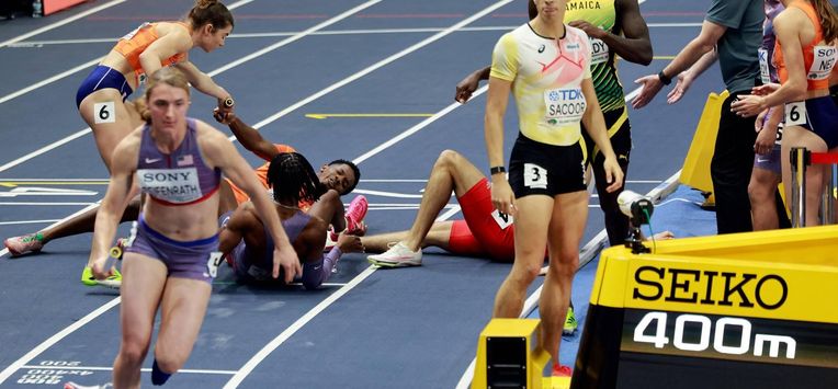 Netherlands' Keenan Blake is seen on the floor after a handover in the 4 x 400m relay final during the World Athletics Indoor Championships Kujawy Pomorze 2026 in Torun, Poland on March 21, 2026. 
Wojtek RADWANSKI / AFP