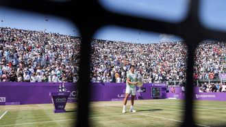 Spain's Carlos Alcaraz celebrates with the trophy after winning against Australia's Alex de Minaur at the end of their men's singles final match at the Cinch ATP tennis Championships at Queen's Club in west London on June 25, 2023. 
Adrian DENNIS / AFP