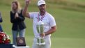 epa13055296 Wyndham Clark of the US celebrates with the trophy after winning the 2026 US Open golf tournament at the Shinnecock Hills Golf Club in Southampton, New York, USA, 21 June 2026.  EPA/SARAH YENESEL