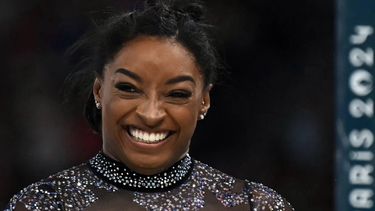 US' Simone Biles reacts after competing in the uneven bars event of the artistic gymnastics women's qualification during the Paris 2024 Olympic Games at the Bercy Arena in Paris, on July 28, 2024. 
Paul ELLIS / AFP