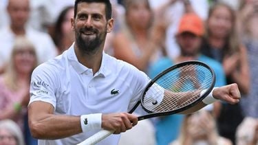 Serbia's Novak Djokovic celebrates after victory over Serbia's Miomir Kecmanovic at the end of their men's singles third round tennis match on the sixth day of the 2025 Wimbledon Championships at The All England Lawn Tennis and Croquet Club in Wimbledon, southwest London, on July 5, 2025. 
Glyn KIRK / AFP