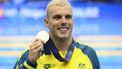 2023-07-27 21:05:08 epa10771401 Gold medalist Kyle Chalmers of Australia poses for photos after the medal ceremony of the Men's 100m Freestyle Final of the World Aquatics Championships 2023 in Fukuoka, Japan, 27 July 2023.  EPA/KIYOSHI OTA