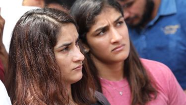 epa10593942 Indian wrestlers Vinesh Phogat (L) and Sangita Phogat (2L) attend a sit-in against India wrestling federation chief Brij Bhushan, in New Delhi, India, 27 April 2023. Protesting wrestlers demanded the arrest of Wrestling Federation of India (WFI) president Brij Bhushan over sexual harassment allegations.  EPA/HARISH TYAGI