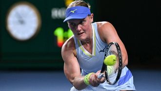 Netherlands' Suzan Lamens hits a return against Austria's Anastasia Potapova during their women's singles match on day one of the Australian Open tennis tournament in Melbourne on January 18, 2026. 
WILLIAM WEST / AFP