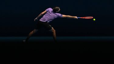 USA's Taylor Fritz hits a return against Chile's Cristian Garin during their men's singles match on day five of the Australian Open tennis tournament in Melbourne on January 16, 2025. 
Paul Crock / AFP
