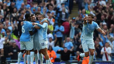 Manchester City's Croatian defender #24 Josko Gvardiol celebrates with teammates after a VAR (Video Assistant Referee) review clears his late goal during the English Premier League football match between Manchester City and AFC Bournemouth  at the Etihad Stadium in Manchester, north west England, on August 23, 2026. 
Darren Staples / AFP