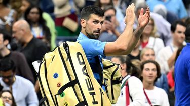 Serbia's Novak Djokovic waves at the crowd after his defeat against Australia's Alexei Popyrin during their men's singles third round match on day five of the US Open tennis tournament at the USTA Billie Jean King National Tennis Center in New York City, on August 30, 2024. 
ANGELA WEISS / AFP