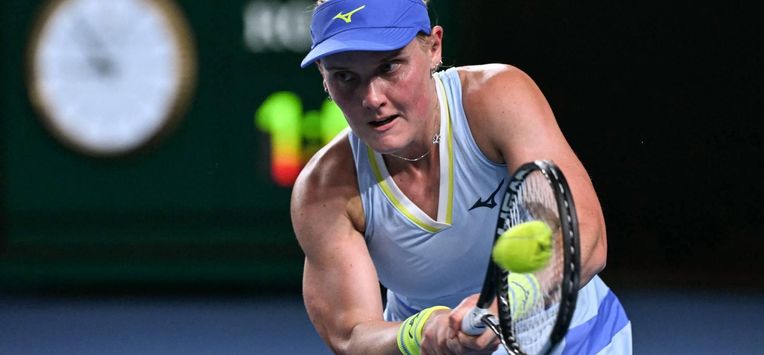Netherlands' Suzan Lamens hits a return against Austria's Anastasia Potapova during their women's singles match on day one of the Australian Open tennis tournament in Melbourne on January 18, 2026. 
WILLIAM WEST / AFP