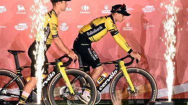Team Visma-Lease a bike's Danish rider Jonas Vingegaard (R) rides his bike on stage during the official teams presentation of the 80th edition of 'La Vuelta' cycling tour of Spain, in Torino, Italy on August 21, 2025. 
Marco BERTORELLO / AFP