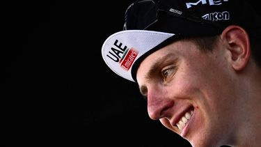 UAE Team Emirates team's Slovenian rider Tadej Pogacar smiles as he celebrates on the podium after winning the 117th edition of the Giro di Lombardia (Tour of Lombardy), a 238km cycling race from Como to Bergamo on October 7, 2023. 
Marco BERTORELLO / AFP