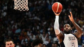 US forward #06 LeBron James shoots the ball during the Basketball Showcase friendly match between the United States and Serbia the at Etihad Arena in Abu Dhabi on July 17, 2024. 
Giuseppe CACACE / AFP