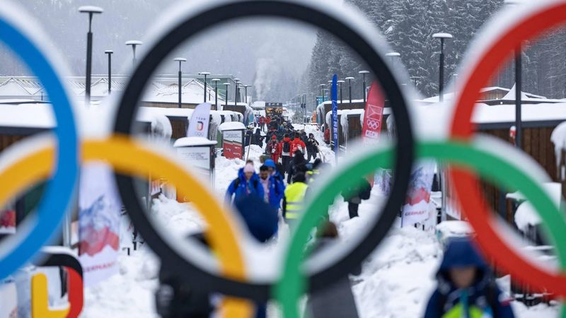 Athletes and team members walk along the accomodation of the Olympic Village ahead of the Milano Cortina 2026 Winter Olympics in Cortina d'Ampezzo on February 3, 2026. 
Odd ANDERSEN / AFP