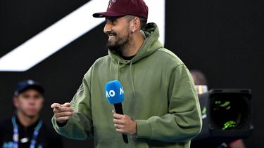 epa11098033 Nick Kyrgios of Australia gestures prior to the post match interview with to Novak Djokovic of Serbia after Djokovic won his quarter final match against Taylor Fritz of the USA at the 2024 Australian Open in Melbourne, Australia, 23 January 2024.  EPA/LUKAS COCH AUSTRALIA AND NEW ZEALAND OUT