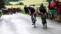 AG2R Citroen Team's French rider Dorian Godon (C) and Intermarche - Circus - Wanty's Belgian rider Rune Herregodts (R) compete in the breakaway during the first stage of the 75th edition of the Criterium du Dauphine cycling race, some 158kms between Chambon-sur-Lac to Chambon-sur-Lac, central France, on June 4, 2023. 
Anne-Christine POUJOULAT / AFP