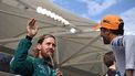 Aston Martin's German driver Sebastian Vettel (L) waves to the crowds as McLaren's Australian driver Daniel Ricciardo (R) looks on during driver's parage ahead of the Abu Dhabi Formula One Grand Prix at the Yas Marina Circuit in the Emirati city of Abu Dhabi on November 20, 2022. 
Ben Stansall / AFP