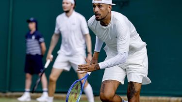 epa13078401 Nick Kyrgios (foreground) of Australia and Alexander Bublik of Kazakhstan in action during their Men's Doubles first round match against Marcelo Arevalo of El Salvador and Mate Pavic of Croatia at the Wimbledon Championships in London, Britain, 01 July 2026.  EPA/TOLGA AKMEN