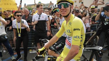 UAE Team Emirates team's Slovenian rider Tadej Pogacar wearing the overall leader's yellow jersey awaits the start of the 3rd stage of the 111th edition of the Tour de France cycling race, 230,5 km between Piacenza and Turin, on July 1, 2024. 
Thomas SAMSON / AFP