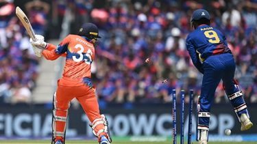 Netherland’s Captain Scott Edwards is bowled during the ICC men's Twenty20 World Cup 2024 group D cricket match between the Netherlands and Nepal at the Grand Prairie Cricket Stadium in Grand Prairie, Texas on June 4, 2024.  
Andrew Caballero-Reynolds / AFP