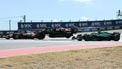 McLaren's Australian driver Oscar Piastri (C) goes airborne alongside McLaren's British driver Lando Norris (L) and Aston Martin's Spanish driver Fernando Alonso (R) during the United States Formula One Sprint at the Circuit of the Americas in Austin, Texas, on October 18, 2025. 
Jim WATSON / AFP