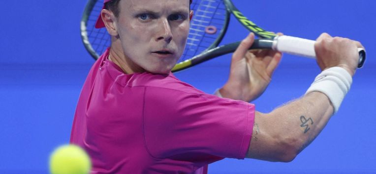 Netherlands’ Jesper De Jong hits a return against Russia's Andrey Rublev during their men’s singles match at the Qatar Open tennis tournament in Doha on February 17, 2026. 
Karim JAAFAR / AFP