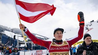 epa11895939 Winner Raphael Haaser of Austria poses with a flag after the Men's Giant Slalom at the FIS Alpine Skiing World Championships in Saalbach Hinterglemm, Austria, 14 February 2025.  EPA/JEAN-CHRISTOPHE BOTT