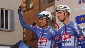 epa11223640 Belgian rider Jasper Philipsen (L) of the team Alpecin - Deceuninck greets spectators before the 115th Milan-Sanremo one-day cycling race, Pavia, Italy, 16 March 2024.  EPA/ROBERTO BETTINI