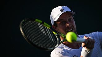 Netherlands' Botic Van De Zandschulp returns the ball to Italy's Matteo Arnaldi during their men's singles first round tennis match on the first day of the 2025 Wimbledon Championships at The All England Lawn Tennis and Croquet Club in Wimbledon, southwest London, on June 30, 2025. 
Kirill KUDRYAVTSEV / AFP