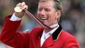 epa00808243 Belgian show jumper Jos Lansik cheers his gold medal won at the Jumping Competition with Rotation of Horses of the FEI World Equestrian Games in Aachen, Germany, Sunday, 03 September 2006. The FEI World Equestrian Games ended today with the Jumping finals.  EPA/Oliver Berg