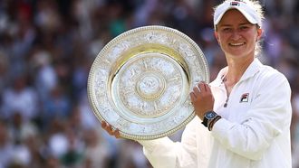 Czech Republic's Barbora Krejcikova poses with the winner's trophy, the Venus Rosewater Dish, after winning against Italy's Jasmine Paolini during their women's singles final tennis match on the thirteenth day of the 2024 Wimbledon Championships at The All England Lawn Tennis and Croquet Club in Wimbledon, southwest London, on July 13, 2024. Krejcikova won the match 6-2, 2-6, 6-4.
HENRY NICHOLLS / AFP