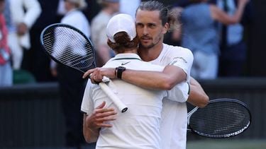 Italy's Jannik Sinner hugs Germany's Alexander Zverev (R) after winning during their men's singles final tennis match on the fourteenth day of the 2026 Wimbledon Championships at The All England Lawn Tennis and Croquet Club in Wimbledon, southwest London, on July 12, 2026. 
Henry NICHOLLS / AFP